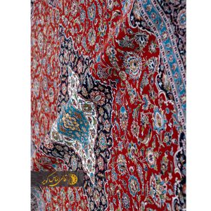 فرش ماشینی کاشان زمینه لاکی قرمز 700 شانه